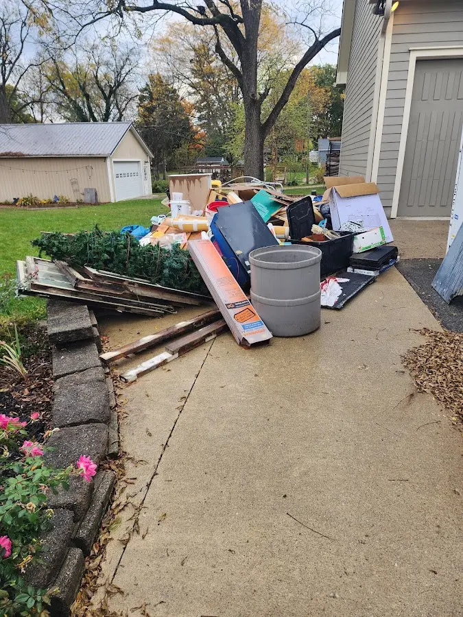Dumpster being loaded with debris for Demolition Dumpster Rental in East Palestine